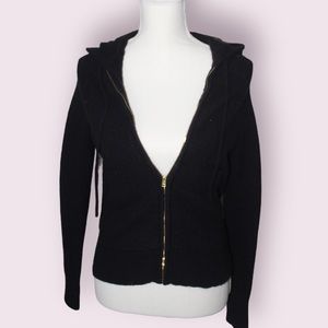Super soft and comfy black zip sweater with gold zipper.